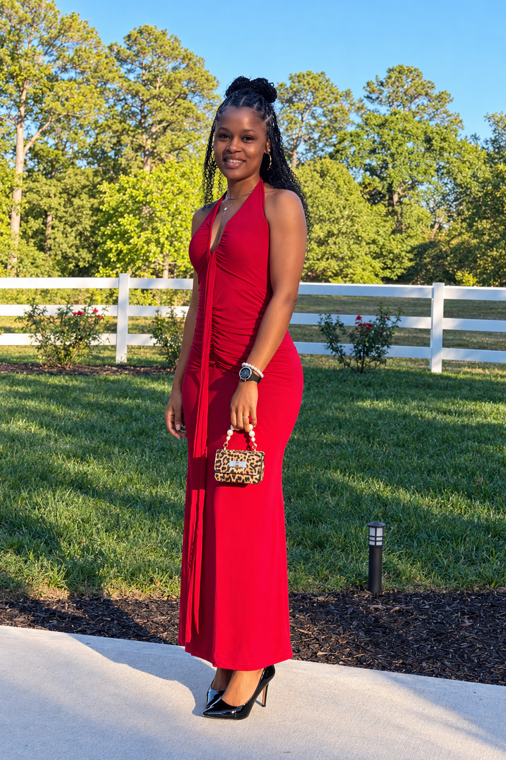 Gioi wearing a red halter dress, leopard bag, watch, pearl bracelet, necklace and hoop earrings